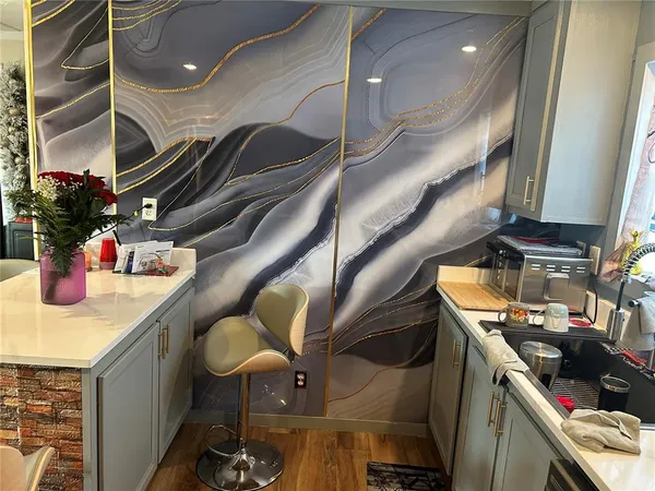 a kitchen with stainless steel appliances granite countertop lots of counter top space