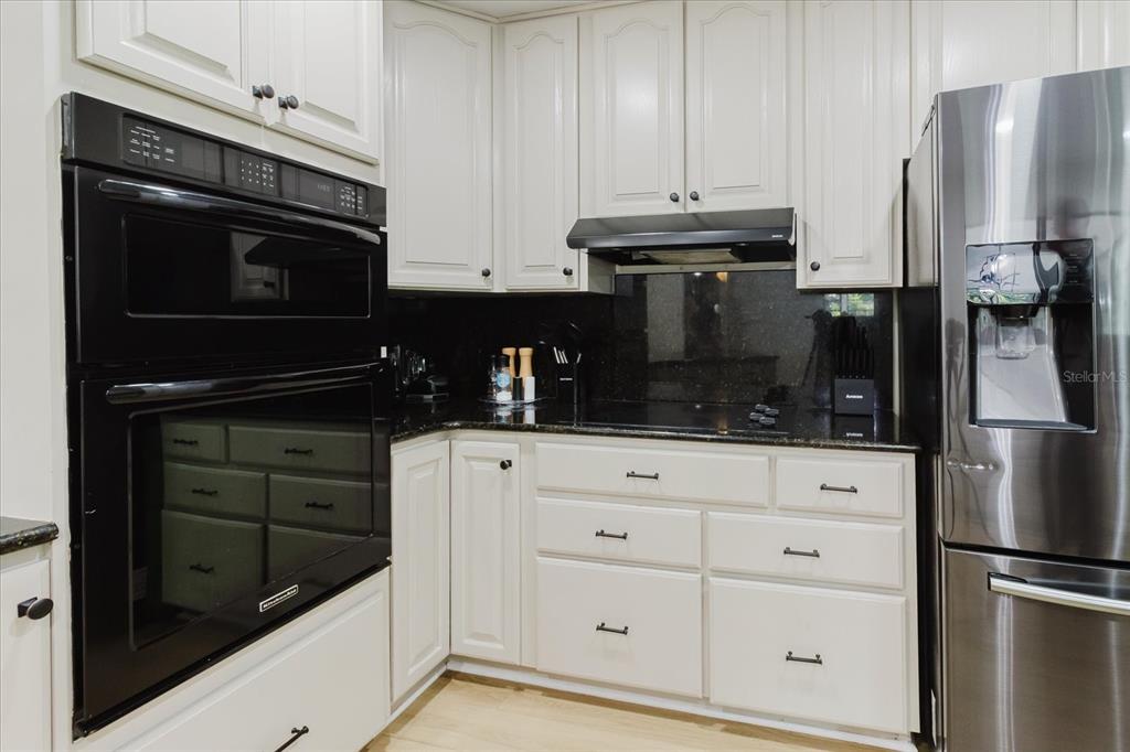 8304 Revels Road Riverview, FL 33569 - Photo 20 of 99 a kitchen with appliances and cabinets