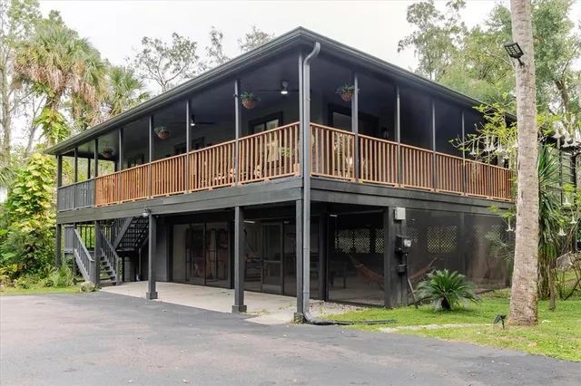 a view of a park with large trees