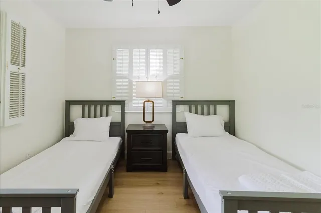 a bedroom with a bed and a lamp