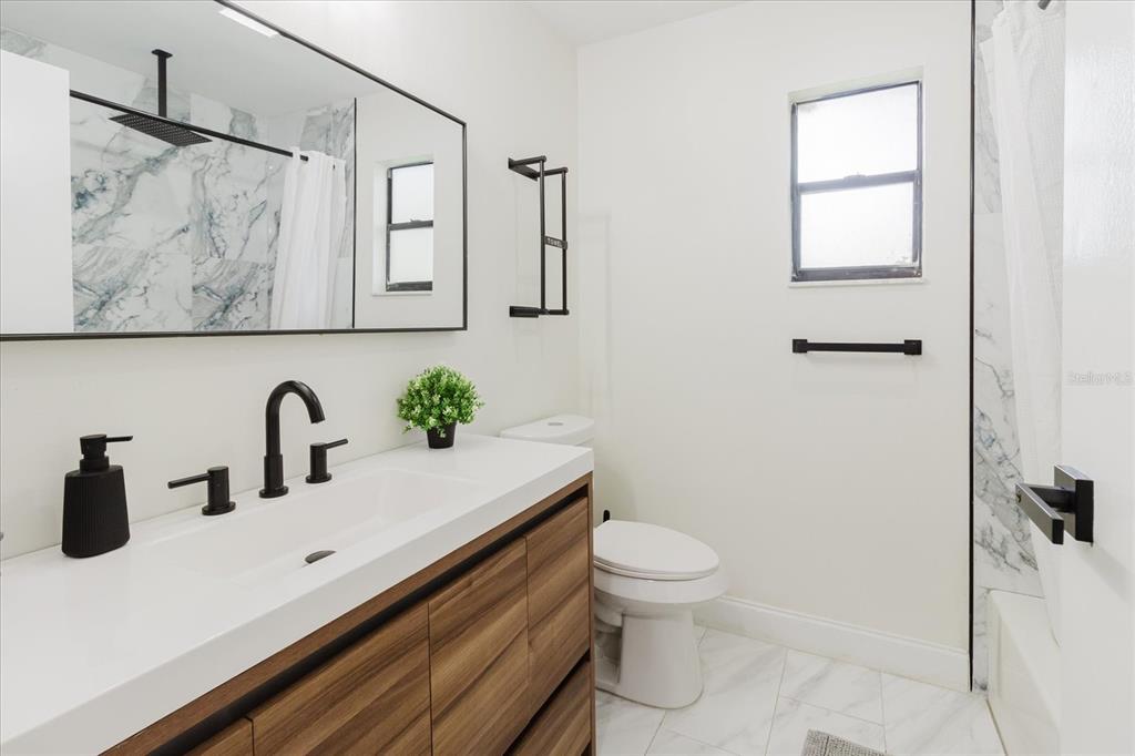 8304 Revels Road Riverview, FL 33569 - Photo 38 of 99 a bathroom with a sink and a toilet