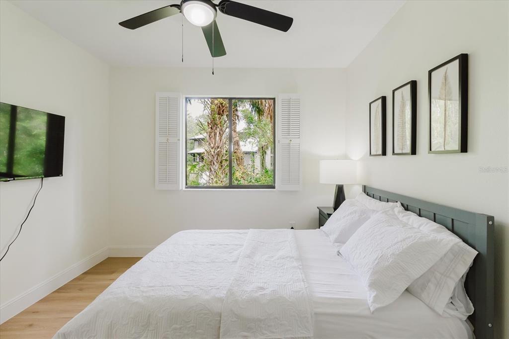 8304 Revels Road Riverview, FL 33569 - Photo 41 of 99 a bedroom with a bed and a flat screen tv