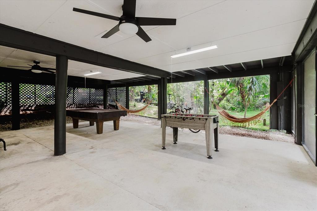 8304 Revels Road Riverview, FL 33569 - Photo 43 of 99 a view of a room with porch and a wooden floor
