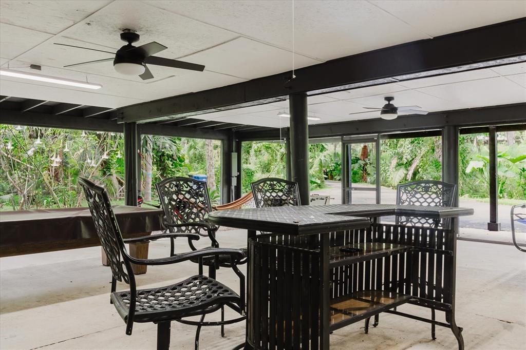 8304 Revels Road Riverview, FL 33569 - Photo 49 of 99 a dining room with furniture window and outside view