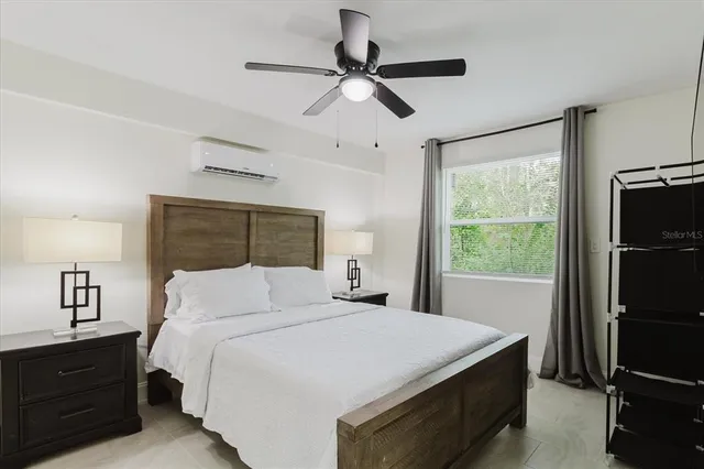 an aerial view of a house with a yard and outdoor seating