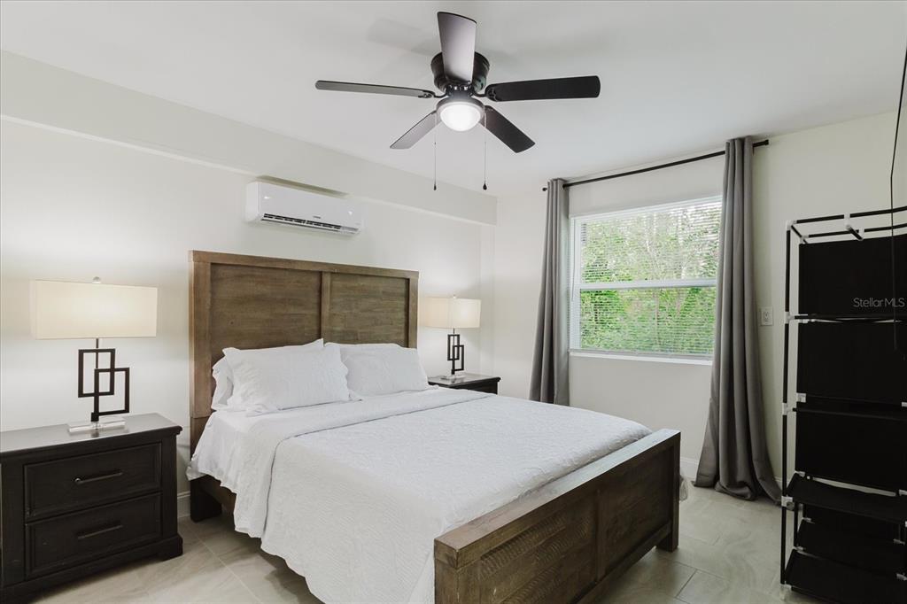 8304 Revels Road Riverview, FL 33569 - Photo 50 of 99 a bedroom with a large bed and a window