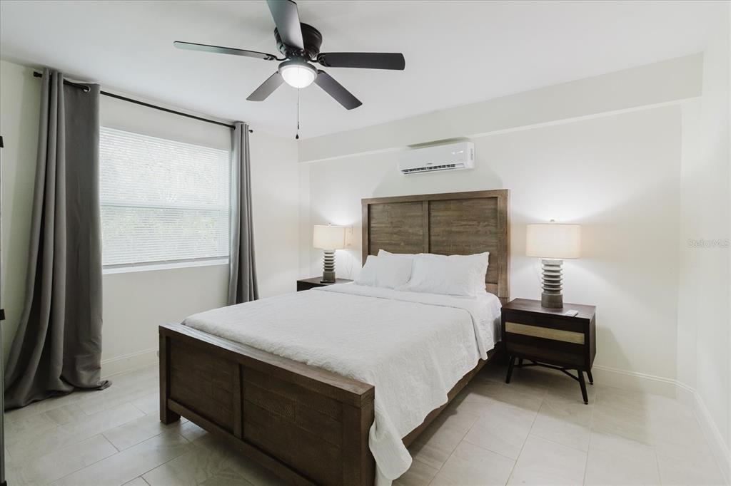 8304 Revels Road Riverview, FL 33569 - Photo 55 of 99 a bedroom with a bed and a ceiling fan