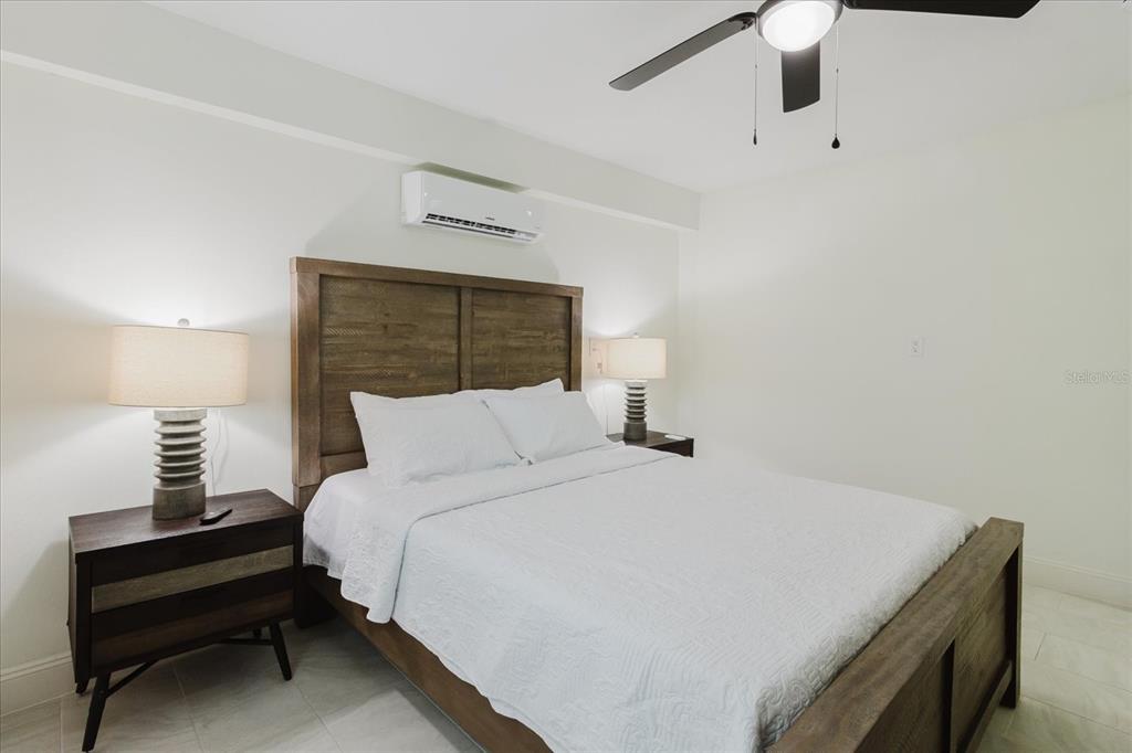 8304 Revels Road Riverview, FL 33569 - Photo 57 of 99 a bedroom with a bed and a lamp