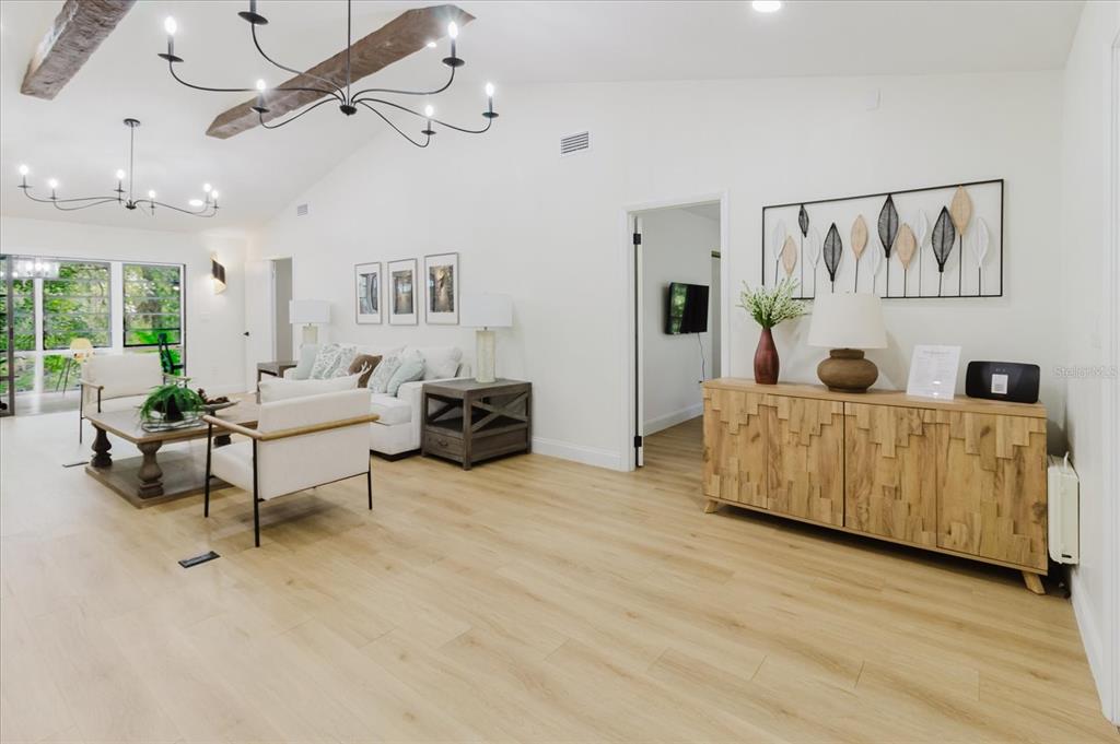 8304 Revels Road Riverview, FL 33569 - Photo 87 of 99 a living room with furniture and a wooden floor