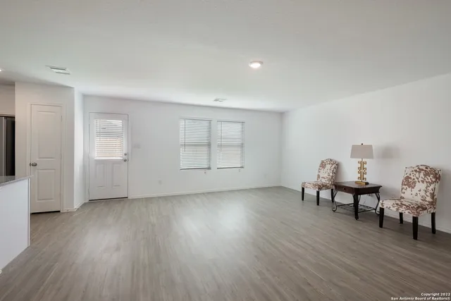 a view of a livingroom with furniture and wooden floor