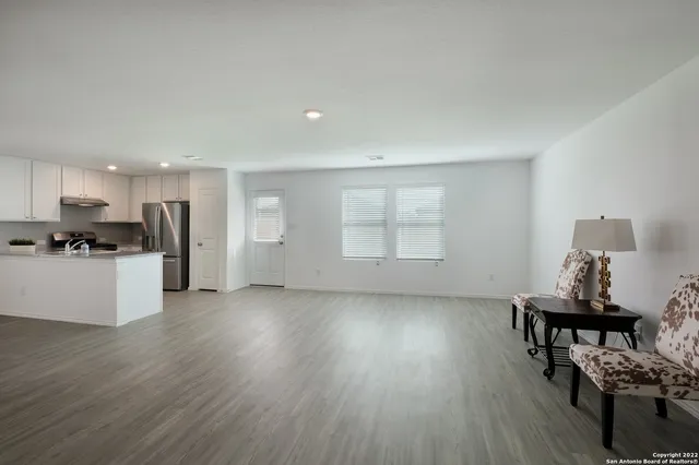 a view of work space with furniture and window