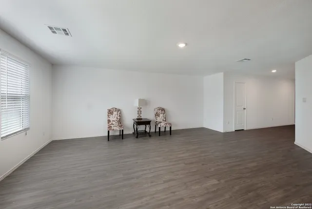 a kitchen with stainless steel appliances a refrigerator sink and white cabinets