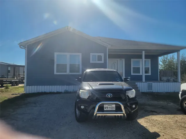 a car parked in front of a house