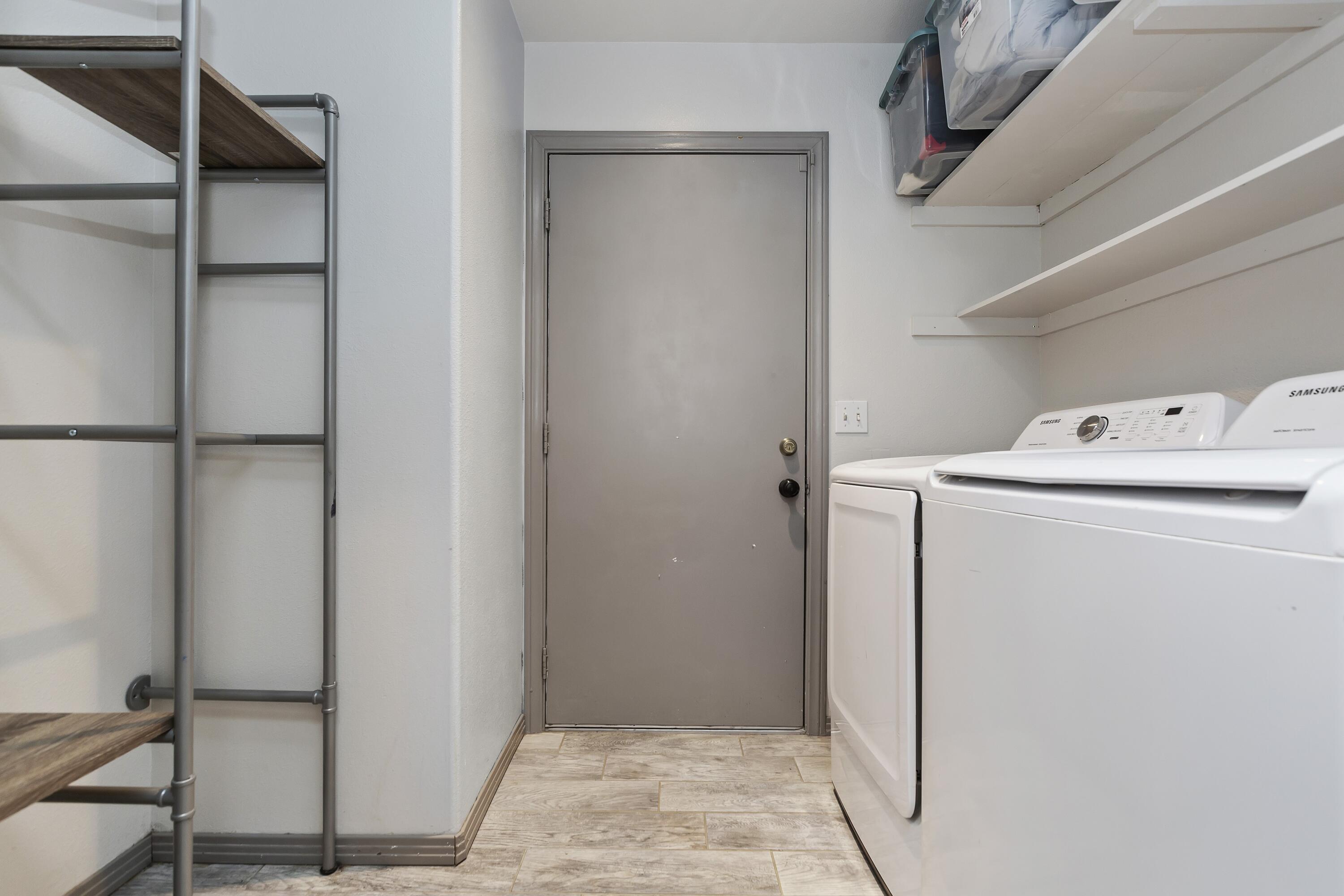 7482 Apache Trail Yucca Valley, CA 92284 - Photo 21 of 38 a utility room with dryer and washer