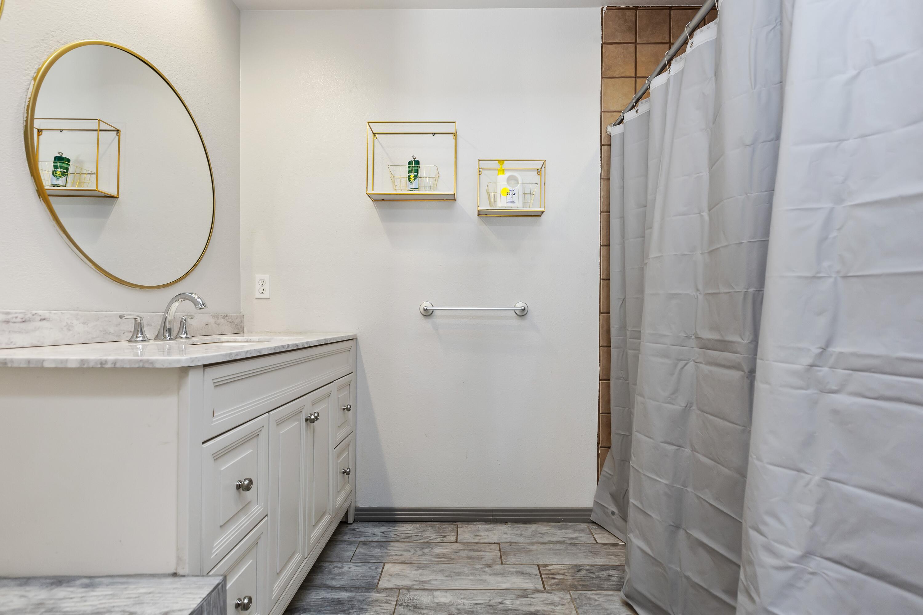 7482 Apache Trail Yucca Valley, CA 92284 - Photo 28 of 38 a bathroom with a double vanity sink and a mirror