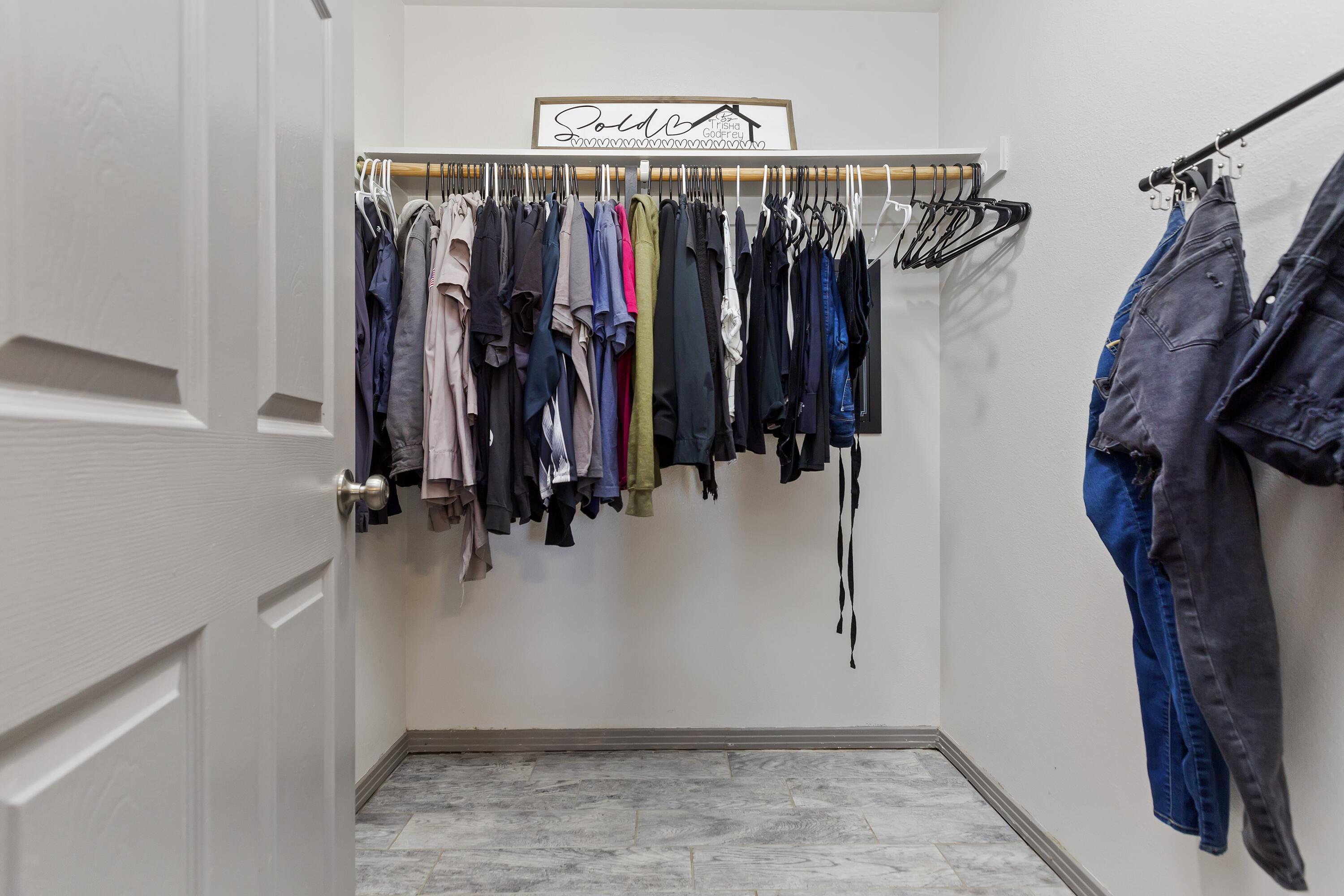 7482 Apache Trail Yucca Valley, CA 92284 - Photo 30 of 38 a view of walk in closet with clothes