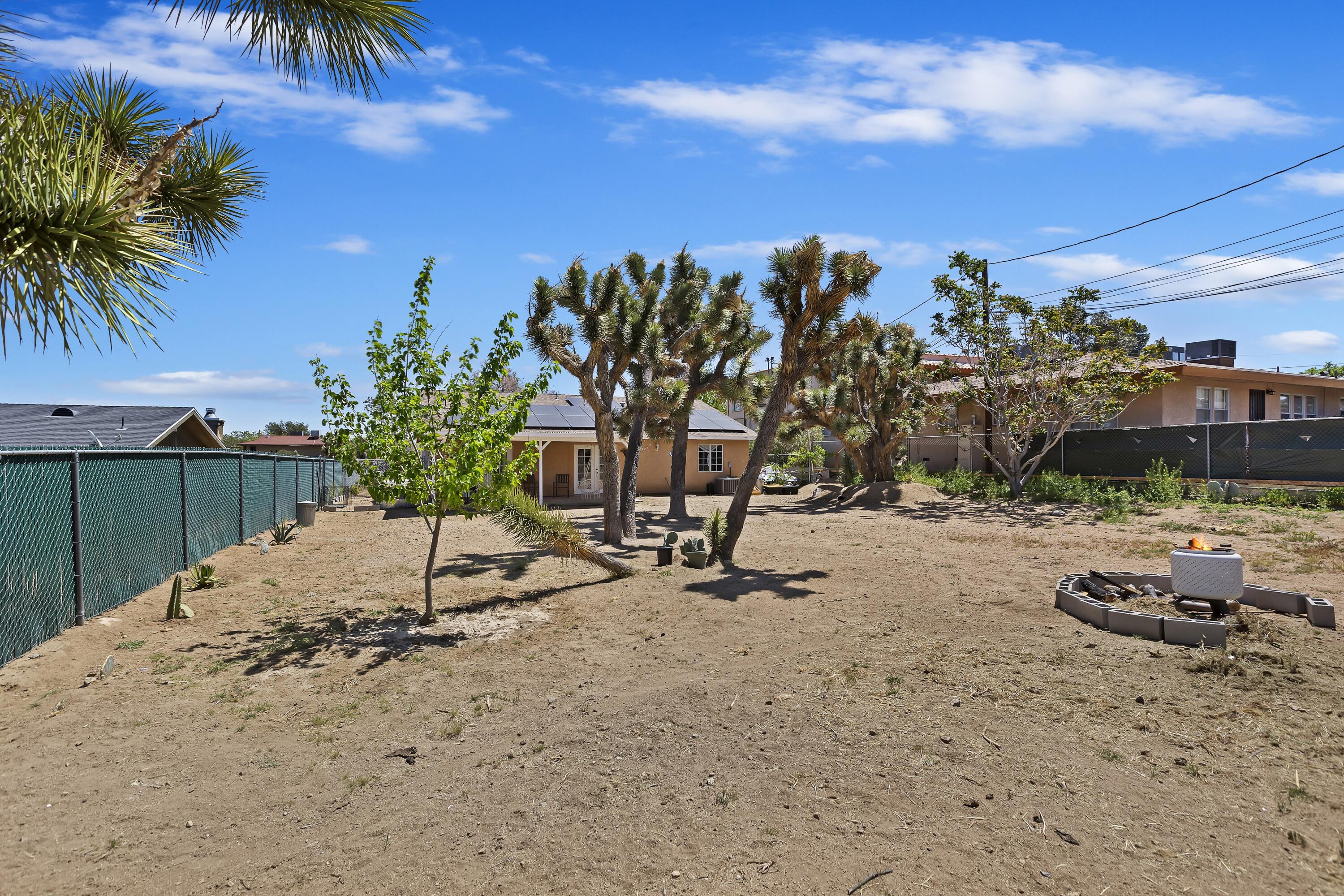 7482 Apache Trail Yucca Valley, CA 92284 - Photo 35 of 38 a view of a backyard of a house