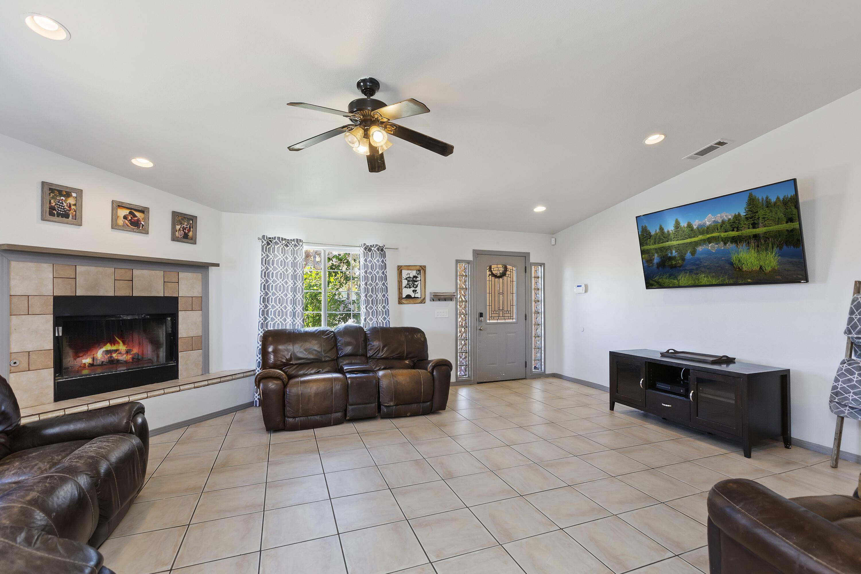 7482 Apache Trail Yucca Valley, CA 92284 - Photo 8 of 38 a living room with furniture and a fireplace