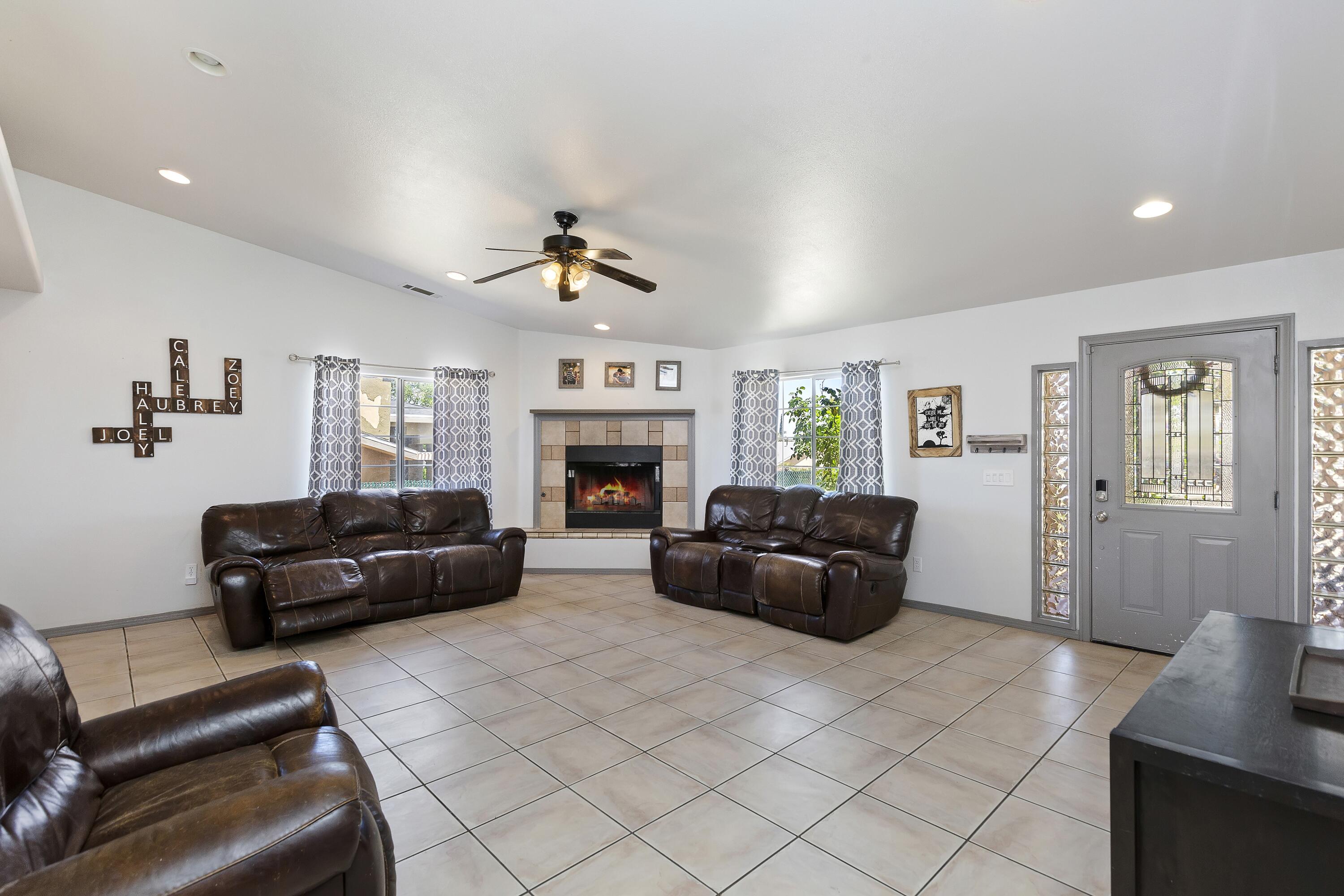 7482 Apache Trail Yucca Valley, CA 92284 - Photo 9 of 38 a living room with furniture and a fireplace