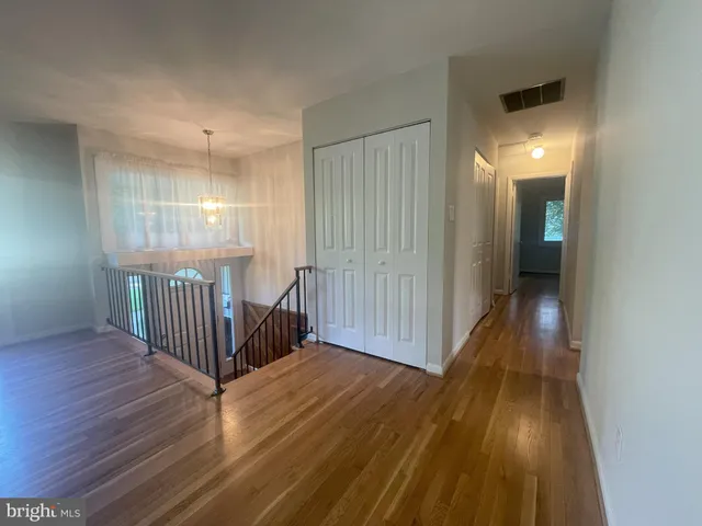 wooden floor in a hall with an entryway