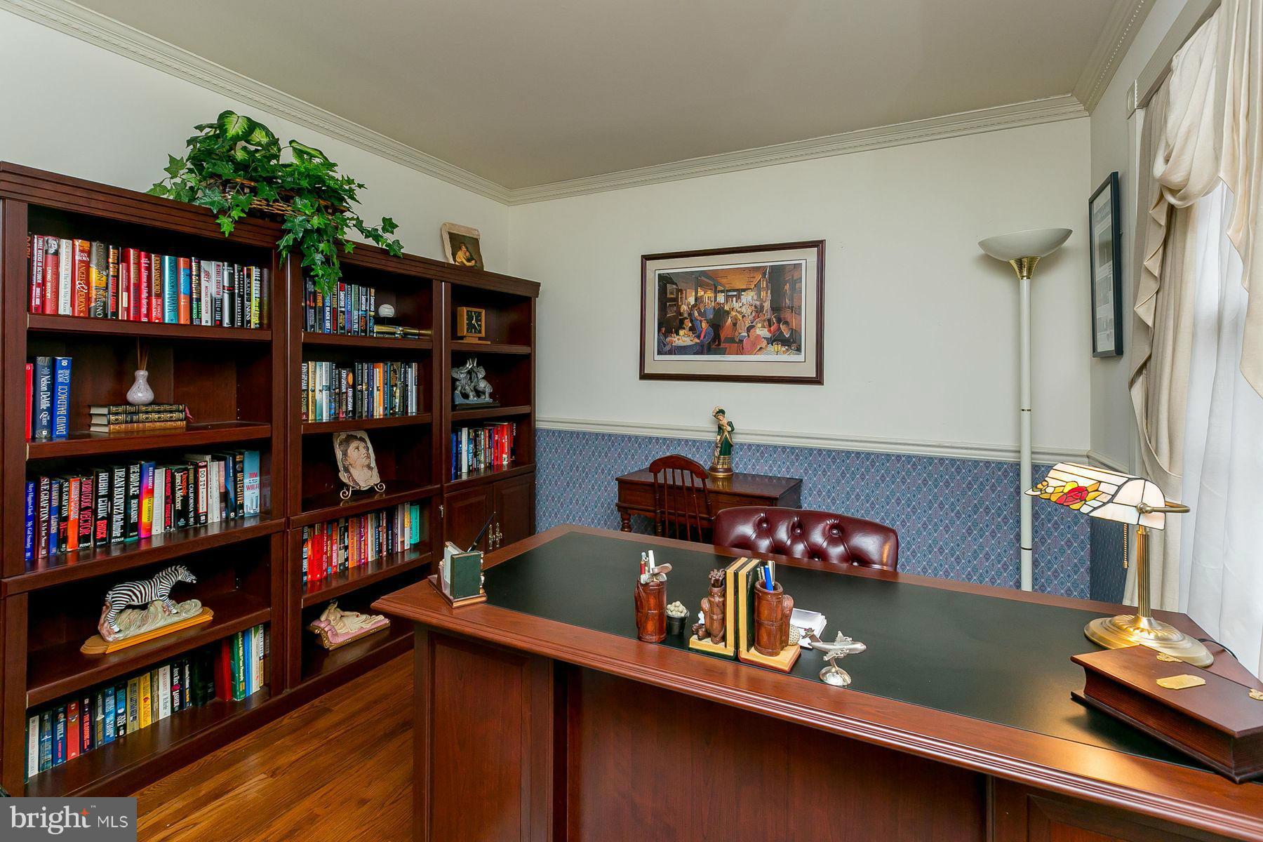 7803 Poplar Grove Road Severn, MD 21144 - Photo 14 of 30 a room with furniture and a book shelf