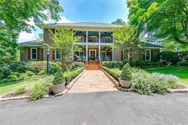 a view of a swimming pool with a yard