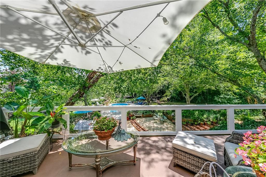 6180 Old Jefferson Road Athens, GA 30607 - Photo 21 of 100 a view of a patio with couches table and chairs and potted plants