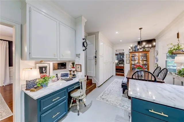 a bed room with a bed and a painting on the wall