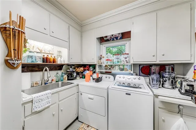 a spacious bedroom with a bed a couch and dresser