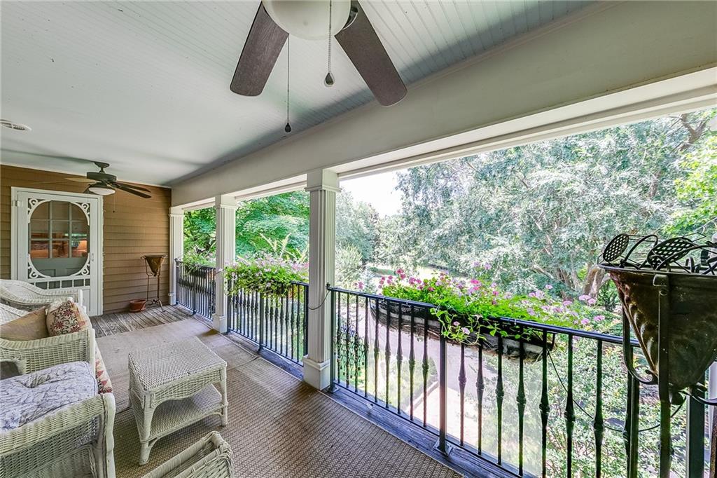 6180 Old Jefferson Road Athens, GA 30607 - Photo 40 of 100 a living room with furniture and a floor to ceiling window
