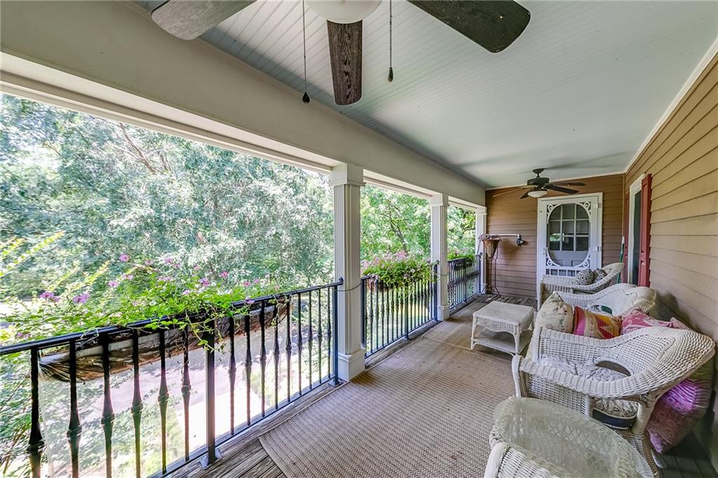 6180 Old Jefferson Road Athens, GA 30607 - Photo 41 of 100 a view of a porch with furniture and garden