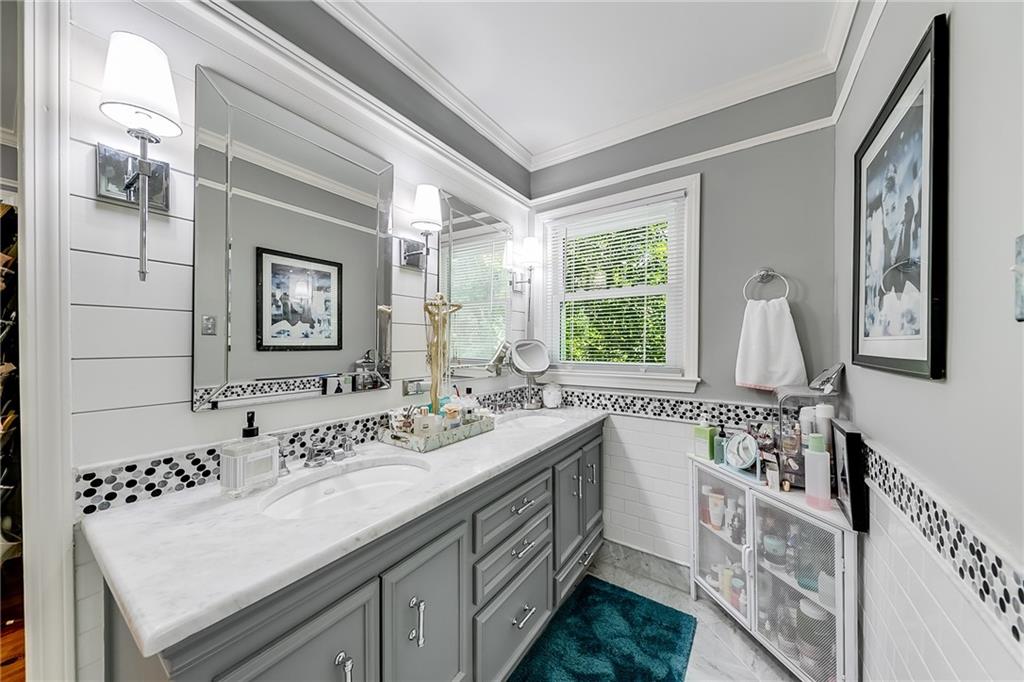6180 Old Jefferson Road Athens, GA 30607 - Photo 46 of 100 a bathroom with a double vanity sink and a large mirror