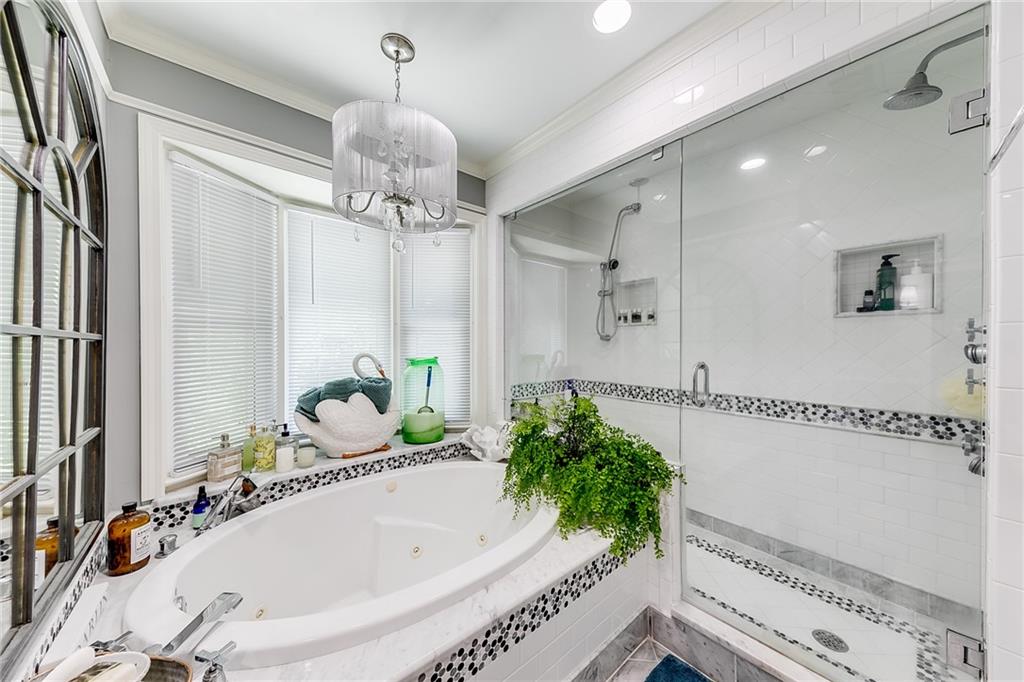 6180 Old Jefferson Road Athens, GA 30607 - Photo 48 of 100 a bathroom with a tub sink and mirror