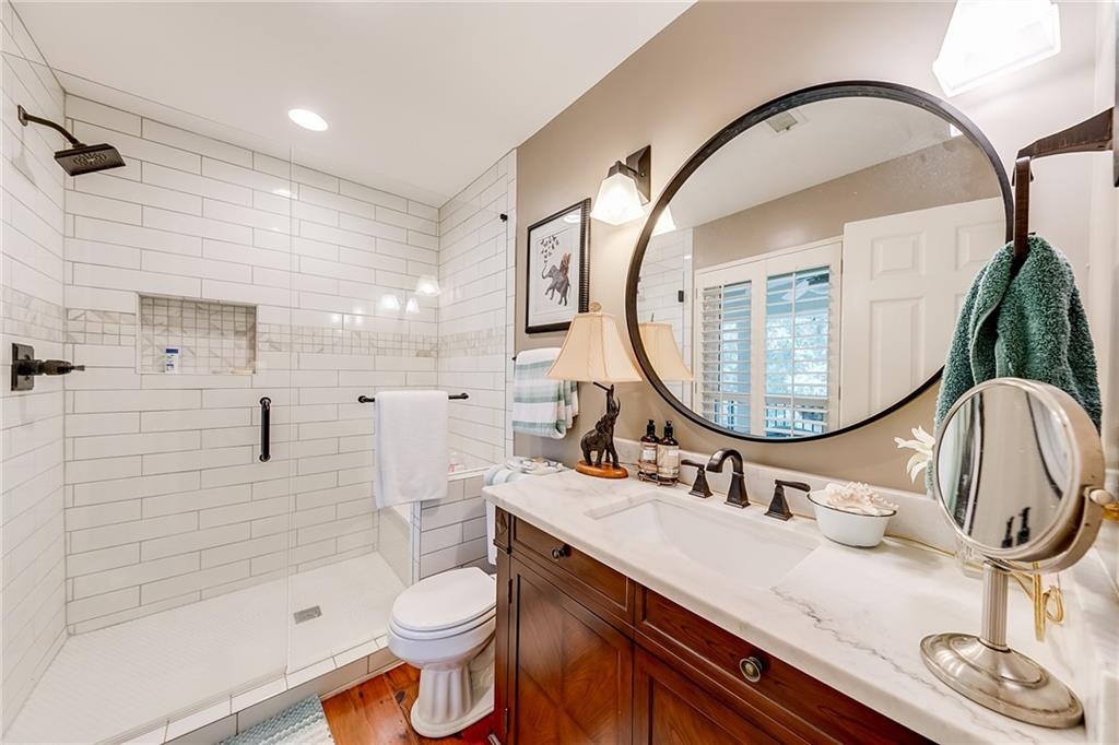6180 Old Jefferson Road Athens, GA 30607 - Photo 51 of 100 a bathroom with a sink a toilet and a mirror