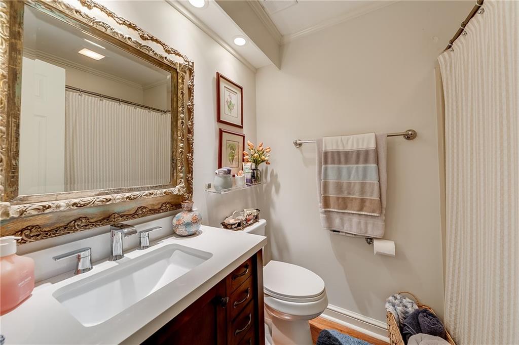 6180 Old Jefferson Road Athens, GA 30607 - Photo 54 of 100 a bathroom with a sink toilet a mirror and shower