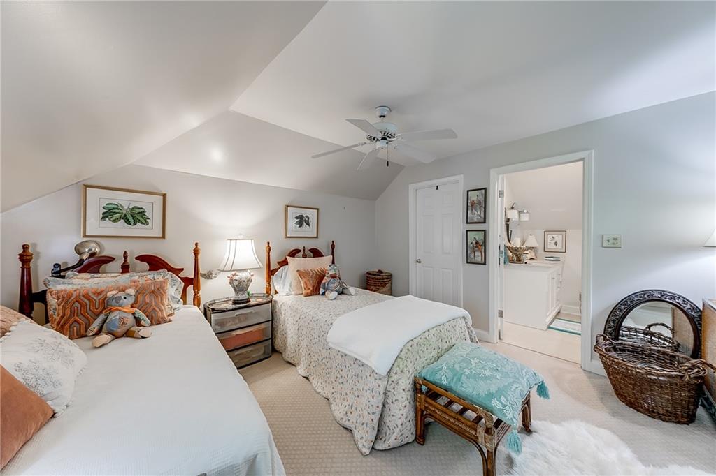 6180 Old Jefferson Road Athens, GA 30607 - Photo 58 of 100 a spacious bedroom with a bed a couch and dresser