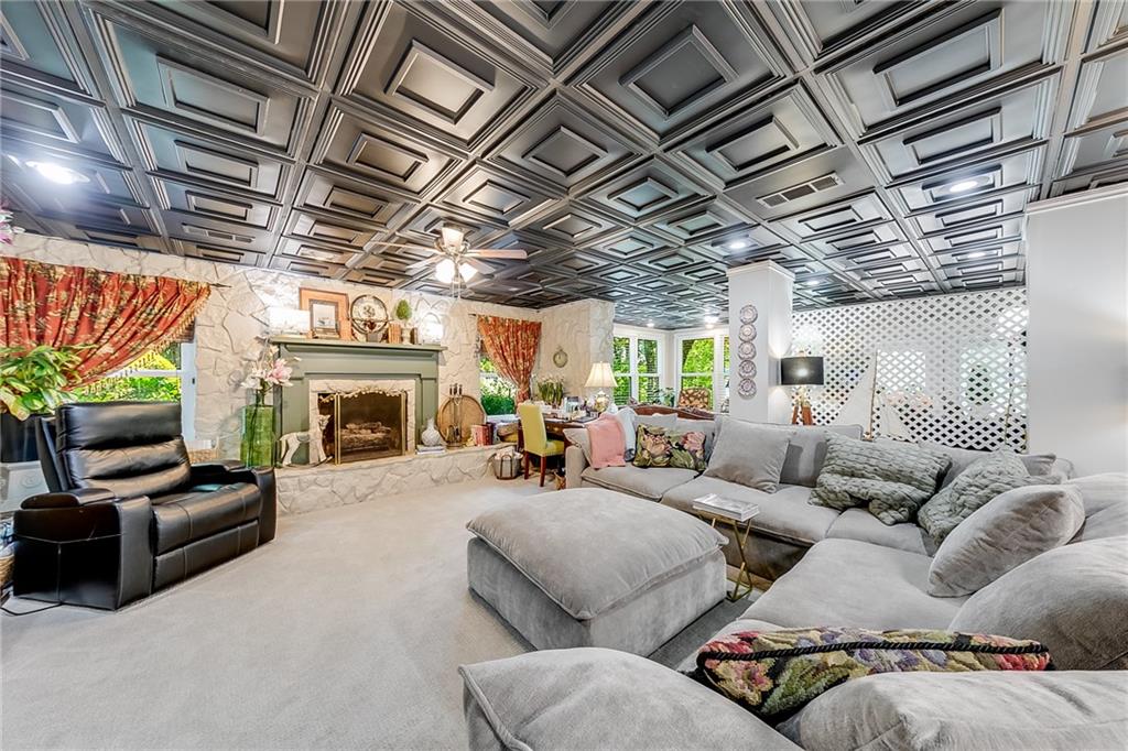 6180 Old Jefferson Road Athens, GA 30607 - Photo 61 of 100 a living room with furniture a fireplace and a flat screen tv