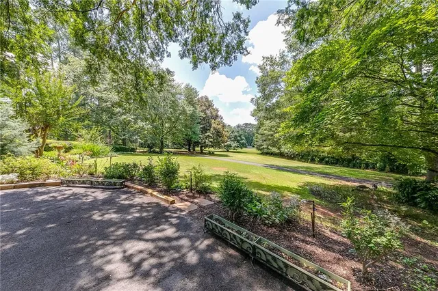 a living room with furniture chandelier and a chandelier