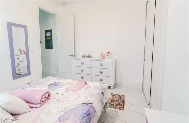 a bedroom with a bed and a cabinets