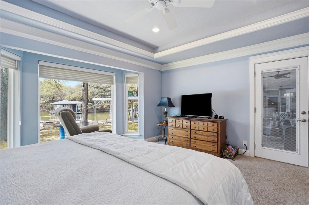 5014 Mohawk Court DeCordova, TX 76049 - Photo 14 of 36 a bedroom with a bed and large window