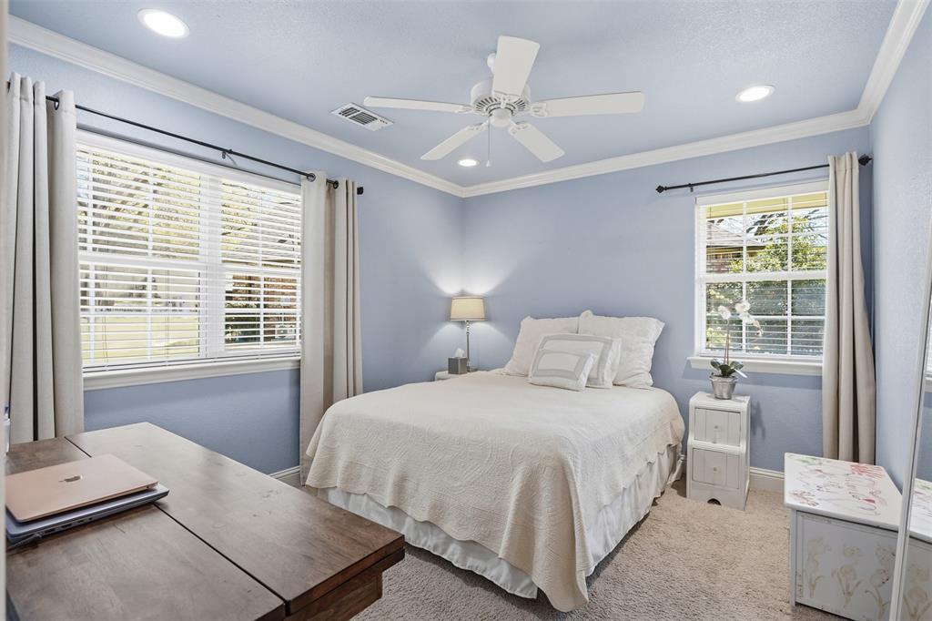 5014 Mohawk Court DeCordova, TX 76049 - Photo 17 of 36 a bedroom with a large bed and a window