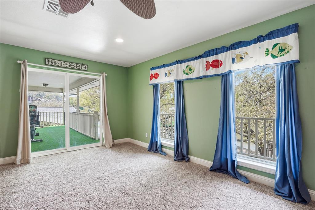 5014 Mohawk Court DeCordova, TX 76049 - Photo 20 of 36 a view of an empty room with closet and windows