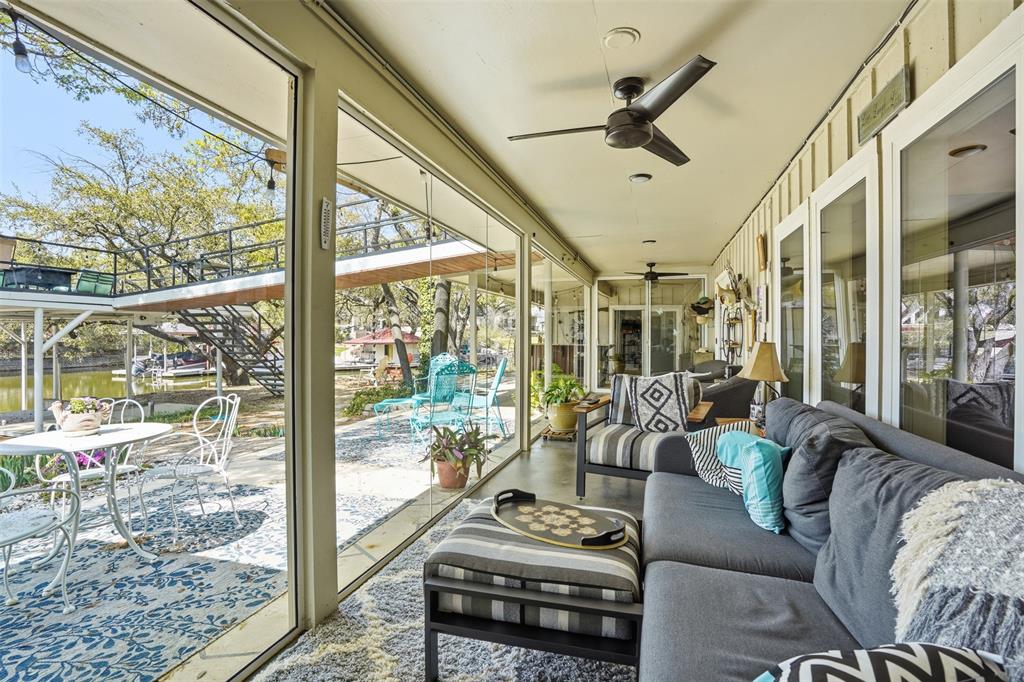 5014 Mohawk Court DeCordova, TX 76049 - Photo 24 of 36 a living room with furniture and a floor to ceiling window