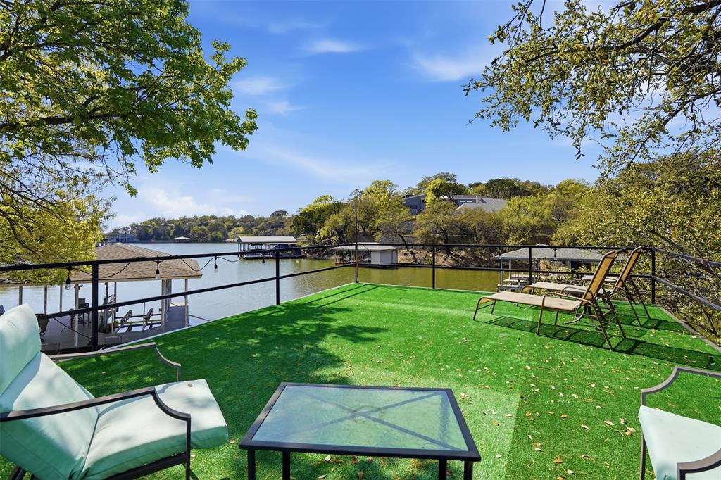 5014 Mohawk Court DeCordova, TX 76049 - Photo 29 of 36 a view of a chair and table on the green field