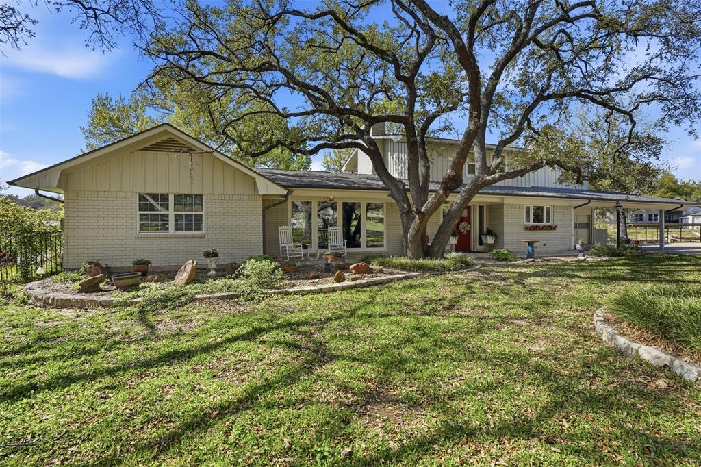 5014 Mohawk Court DeCordova, TX 76049 - Photo 3 of 36 a backyard of a house with table and chairs