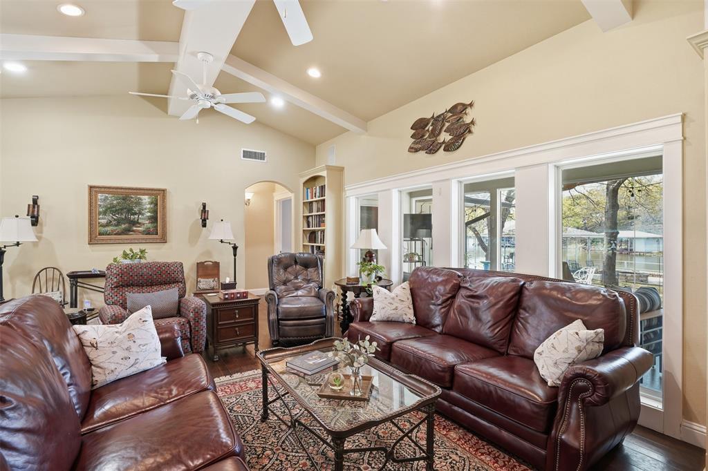 5014 Mohawk Court DeCordova, TX 76049 - Photo 5 of 36 a living room with furniture ceiling fan and a large window