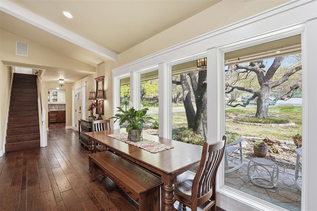 5014 Mohawk Court DeCordova, TX 76049 - Photo 8 of 36 a view of a dining room with furniture window and wooden floor