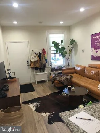 a living room with furniture and a table