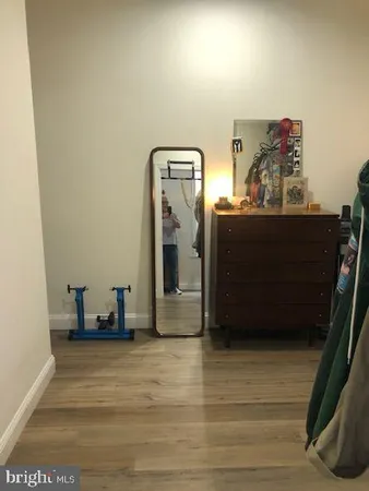 a spacious bedroom with a bed and a window