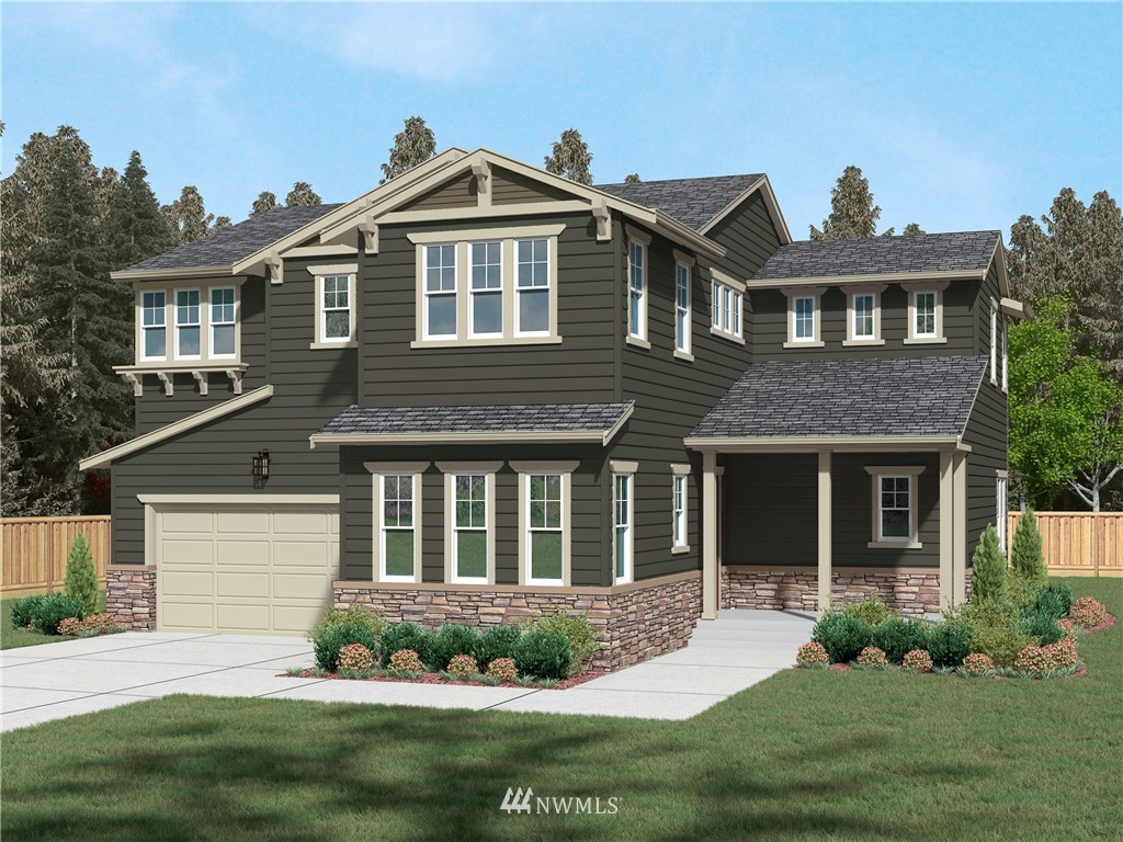 22016 33rd Drive Southeast, Unit 39 Bothell, WA 98021 - Photo 1 of 24 a front view of a house with a yard and garage